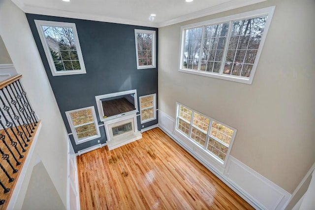 living room with ornamental molding and hardwood / wood-style floors