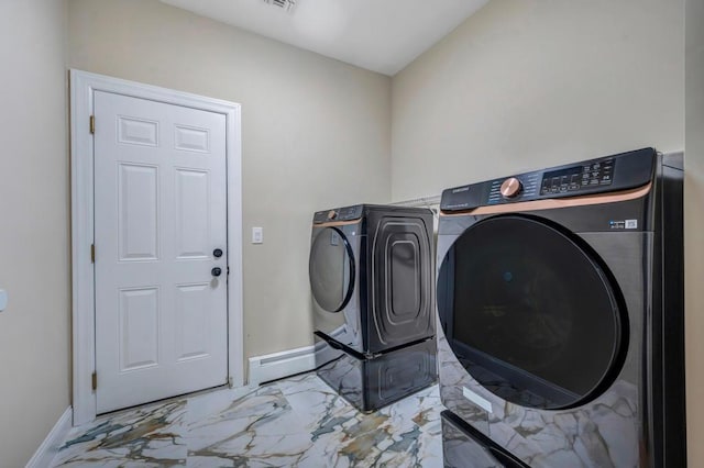 clothes washing area featuring washer and clothes dryer