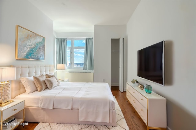 bedroom with wood-type flooring