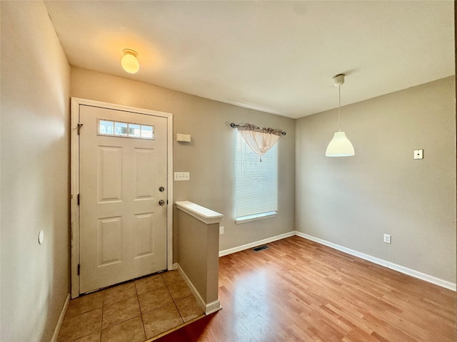 foyer entrance featuring wood-type flooring