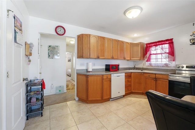 kitchen featuring electric stove, brown cabinets, light tile patterned floors, white dishwasher, and a sink