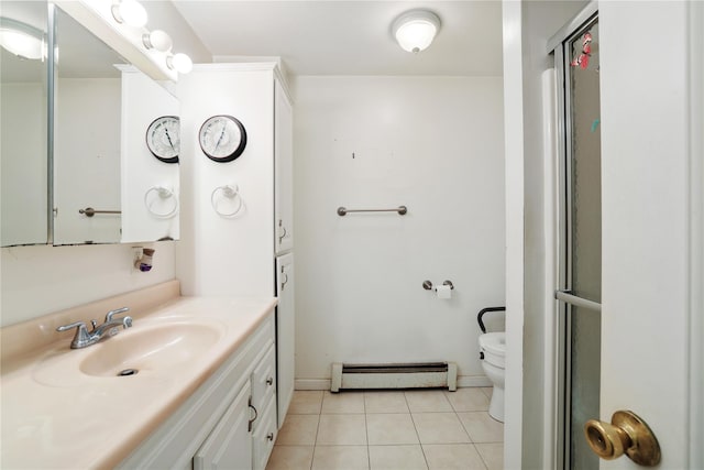 bathroom with a baseboard radiator, vanity, toilet, and tile patterned floors