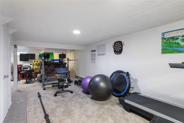 exercise room featuring light colored carpet