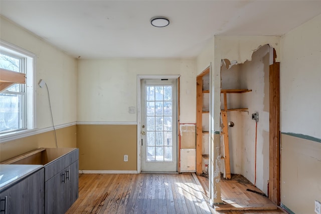 doorway to outside with light wood-type flooring