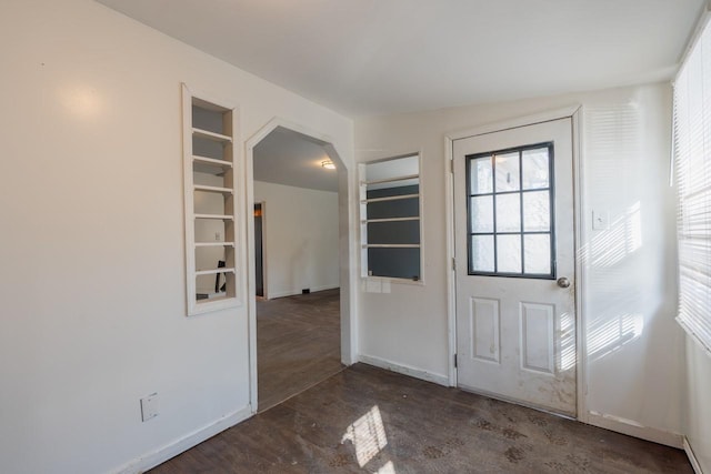34 Laurel Trl, Monroe, NY 10950 - foyer entrance featuring arched walkways, baseboards, and unfinished concrete floors