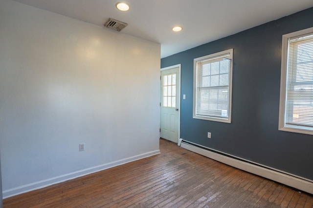 34 Laurel Trl, Monroe, NY 10950 - spare room featuring baseboard heating, baseboards, recessed lighting, visible vents, and wood-type flooring
