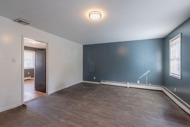 34 Laurel Trl, Monroe, NY 10950 - empty room with visible vents, a baseboard heating unit, baseboards, and wood finished floors