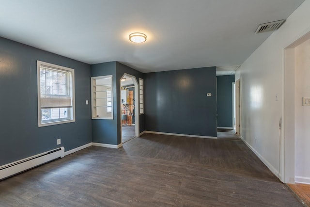 34 Laurel Trl, Monroe, NY 10950 - empty room with visible vents, a baseboard heating unit, baseboards, and wood finished floors