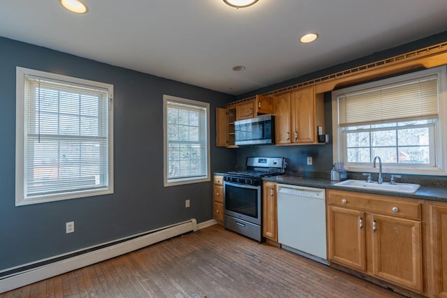 34 Laurel Trl, Monroe, NY 10950 - kitchen with a baseboard heating unit, dark countertops, a wealth of natural light, stainless steel appliances, and a sink