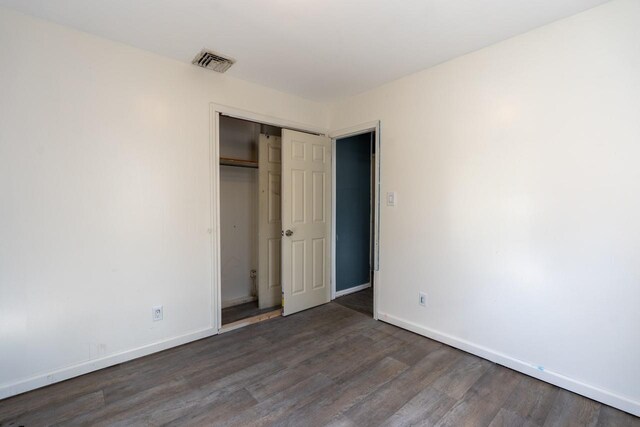 34 Laurel Trl, Monroe, NY 10950 - unfurnished bedroom with wood finished floors, baseboards, a closet, and visible vents