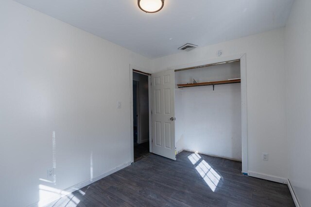 34 Laurel Trl, Monroe, NY 10950 - unfurnished bedroom featuring baseboards, wood finished floors, a closet, and visible vents