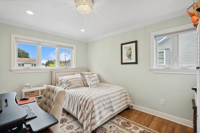 bedroom featuring recessed lighting, baseboards, wood finished floors, and ornamental molding