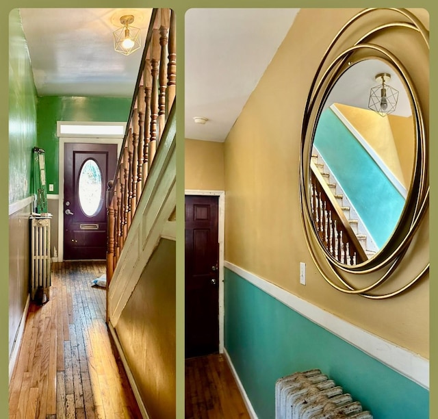 staircase featuring wood-type flooring and radiator heating unit