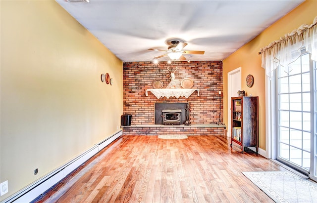 8 Lucky Ln, Washingtonville, NY 10992 - unfurnished living room featuring a baseboard radiator, a ceiling fan, and wood finished floors