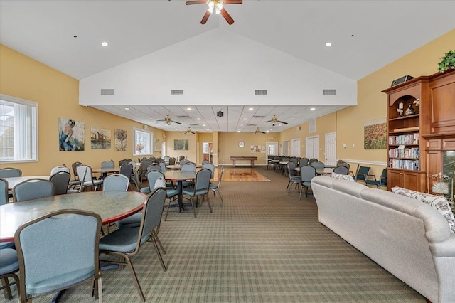 dining area with ceiling fan, carpet flooring, and visible vents