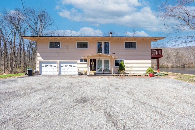 810 Haverstraw Rd, Suffern, NY 10901 - view of front of property featuring an attached garage and aphalt driveway