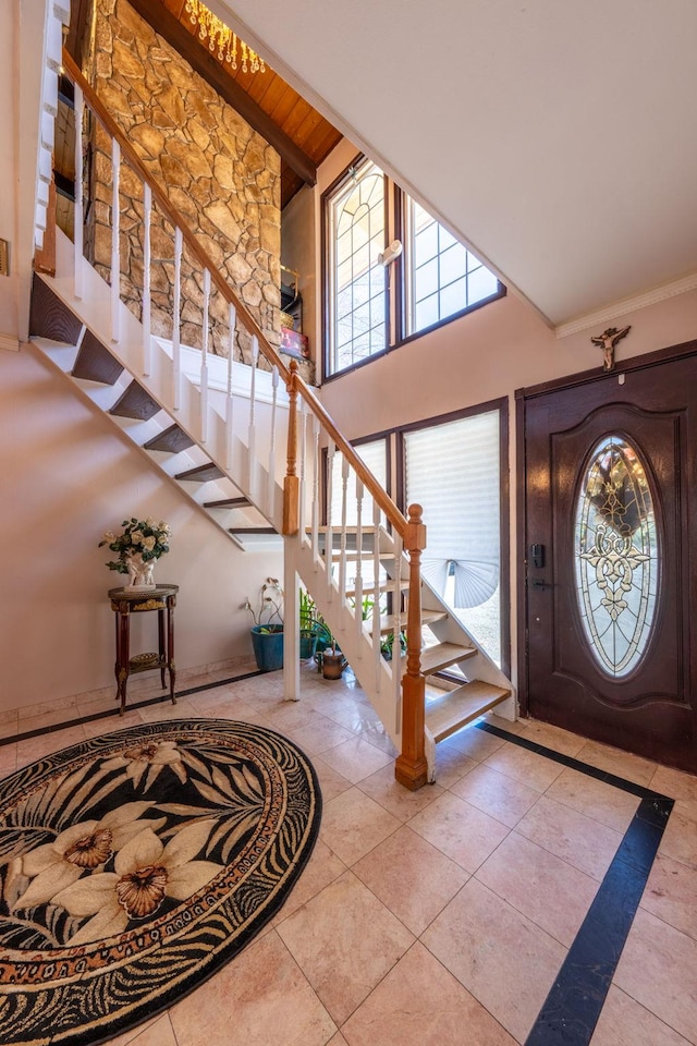 810 Haverstraw Rd, Suffern, NY 10901 - tiled foyer featuring a high ceiling, stairs, and a healthy amount of sunlight
