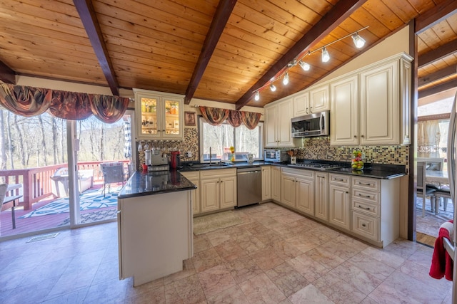 810 Haverstraw Rd, Suffern, NY 10901 - kitchen featuring dark countertops, a sink, wooden ceiling, a peninsula, and appliances with stainless steel finishes