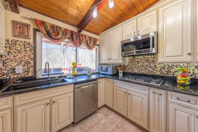 810 Haverstraw Rd, Suffern, NY 10901 - kitchen with stainless steel appliances, a sink, and cream cabinetry