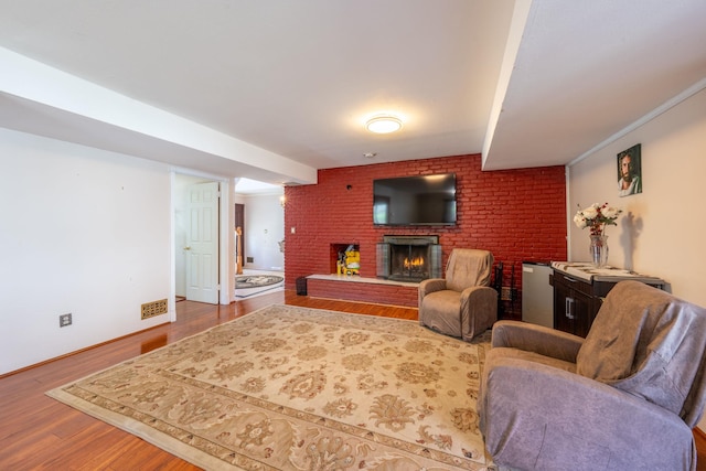 810 Haverstraw Rd, Suffern, NY 10901 - living area featuring wood finished floors and a brick fireplace