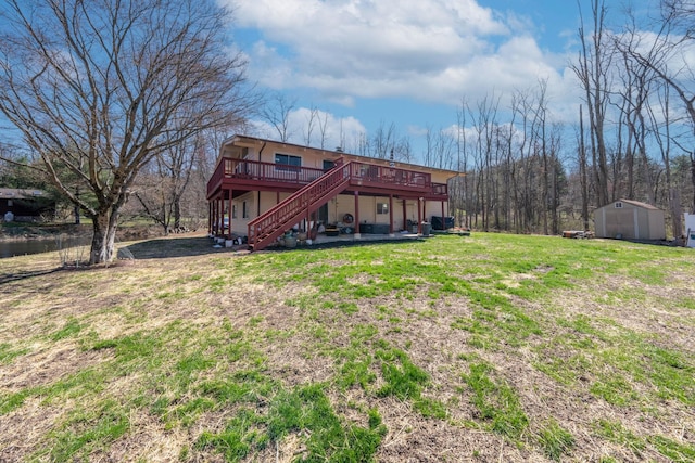 810 Haverstraw Rd, Suffern, NY 10901 - back of property featuring stairway, a shed, a deck, an outdoor structure, and a yard