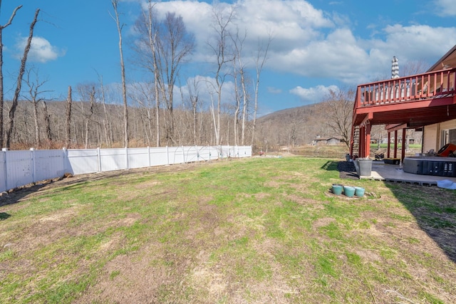 810 Haverstraw Rd, Suffern, NY 10901 - view of yard with a deck with mountain view, a patio, and a fenced backyard