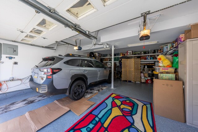 810 Haverstraw Rd, Suffern, NY 10901 - garage with electric panel and a garage door opener