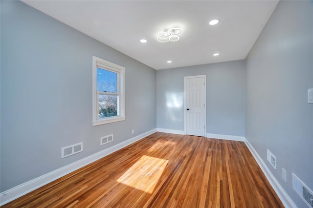 empty room featuring wood-type flooring