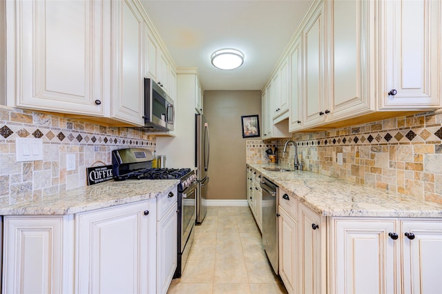 15 Bryant Cres Unit 1K, White Plains, NY 10605 - kitchen featuring appliances with stainless steel finishes, sink, light stone counters, and light tile patterned floors