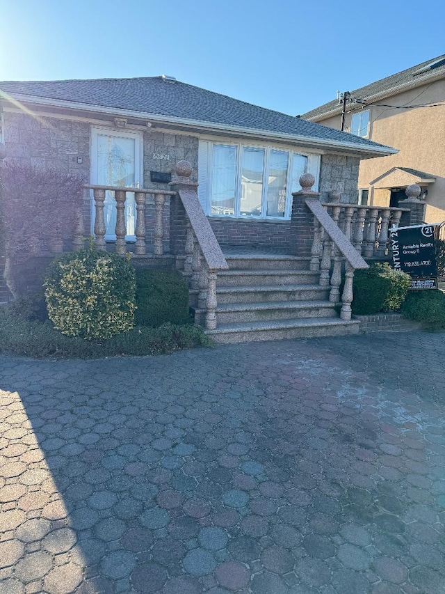 view of front of property featuring stone siding