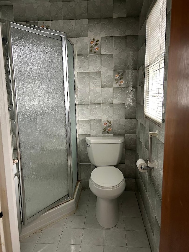 158-24 81st St, Howard Beach, NY 11414 - full bath with tile walls, tile patterned floors, a shower stall, and toilet