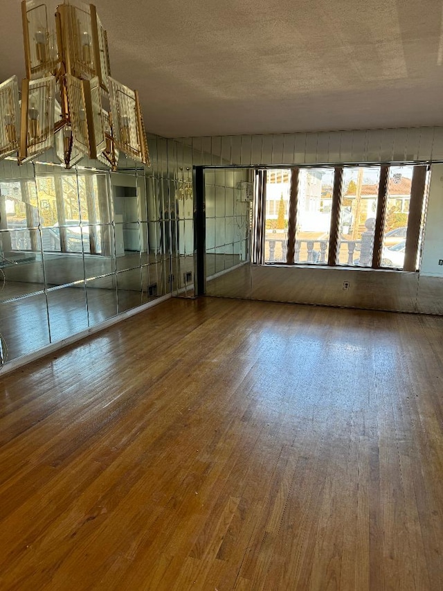 158-24 81st St, Howard Beach, NY 11414 - empty room with plenty of natural light and hardwood / wood-style flooring