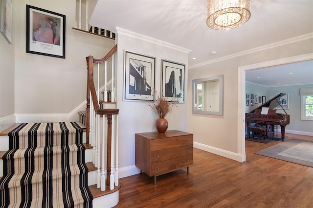 interior space featuring wood finished floors, baseboards, stairs, an inviting chandelier, and crown molding