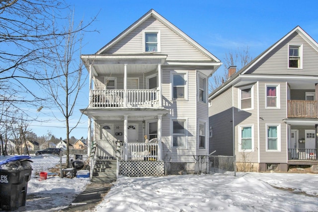 view of front of home with a porch and a balcony