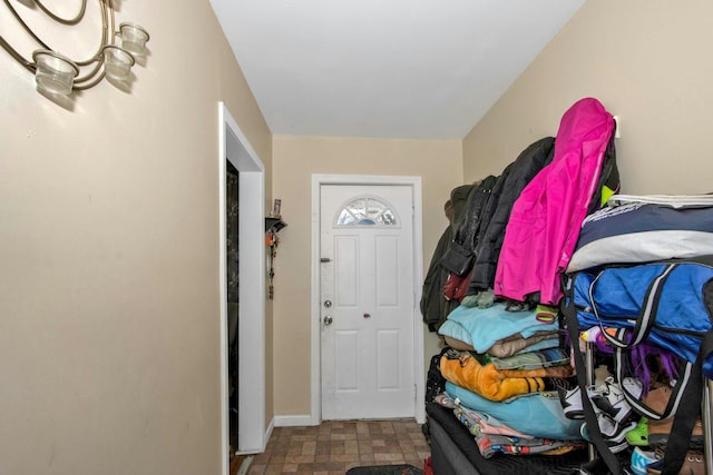 entryway featuring baseboards