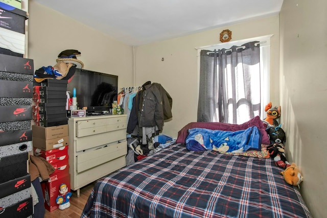 bedroom featuring wood finished floors