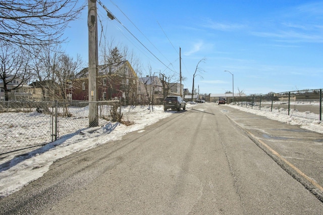 view of road featuring street lighting and a residential view