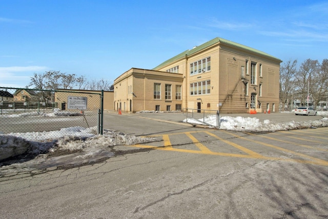 view of building exterior featuring fence