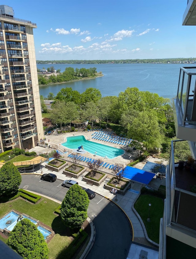 view of pool with a water view