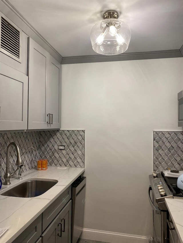 kitchen featuring gray cabinetry and light stone counters