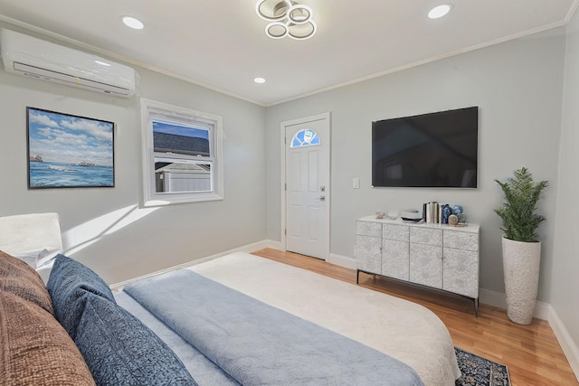 bedroom featuring crown molding, a wall mounted AC, and hardwood / wood-style flooring