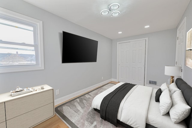 bedroom with a closet and light wood-type flooring