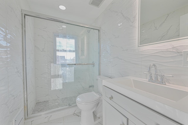 bathroom with vanity, tile walls, an enclosed shower, and toilet