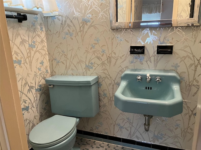 bathroom with sink, tile patterned floors, and toilet