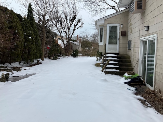 view of yard layered in snow