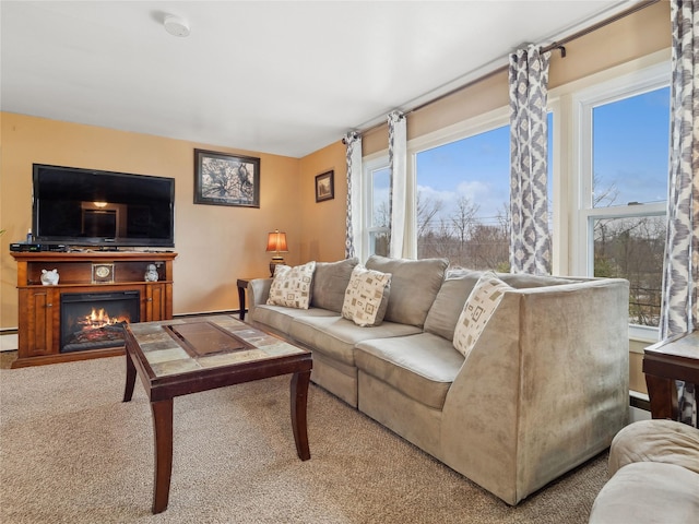 carpeted living room featuring a baseboard heating unit