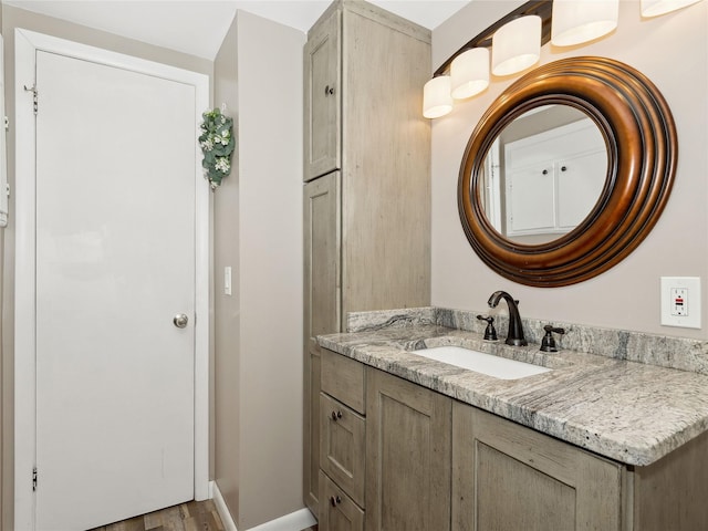 bathroom featuring hardwood / wood-style flooring and vanity