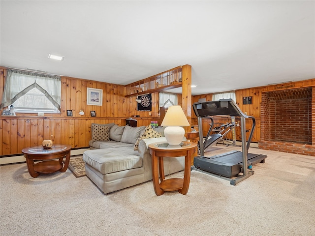 living room with carpet, wooden walls, and baseboard heating