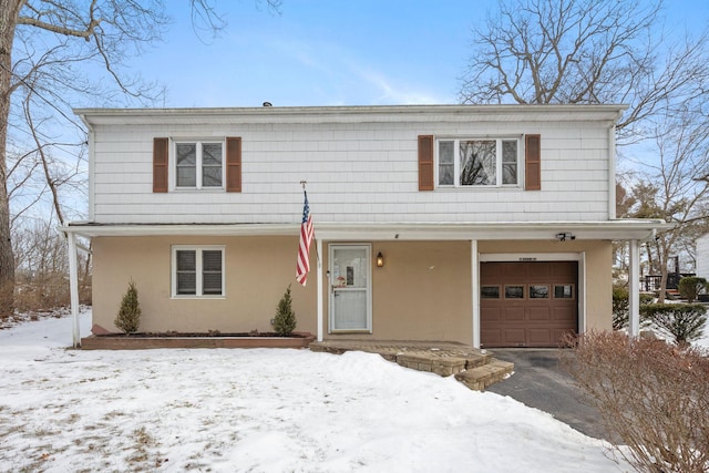 view of front of property with a garage