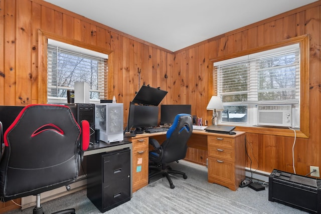 carpeted office featuring a baseboard heating unit and wood walls